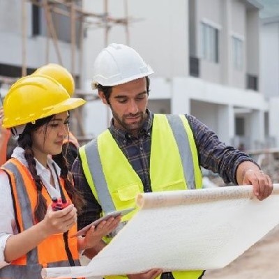 people analyzing a structure plan